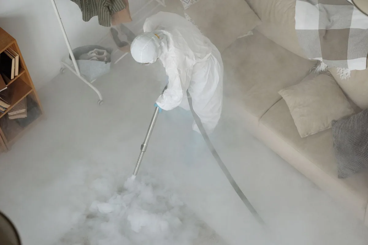 Biohazard cleanup technician in protective equipment, West Memphis, AR